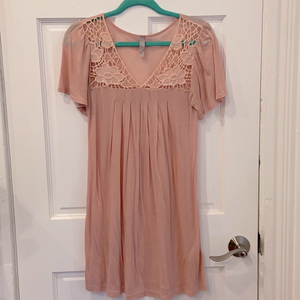 Pale pink dress with floral cutouts